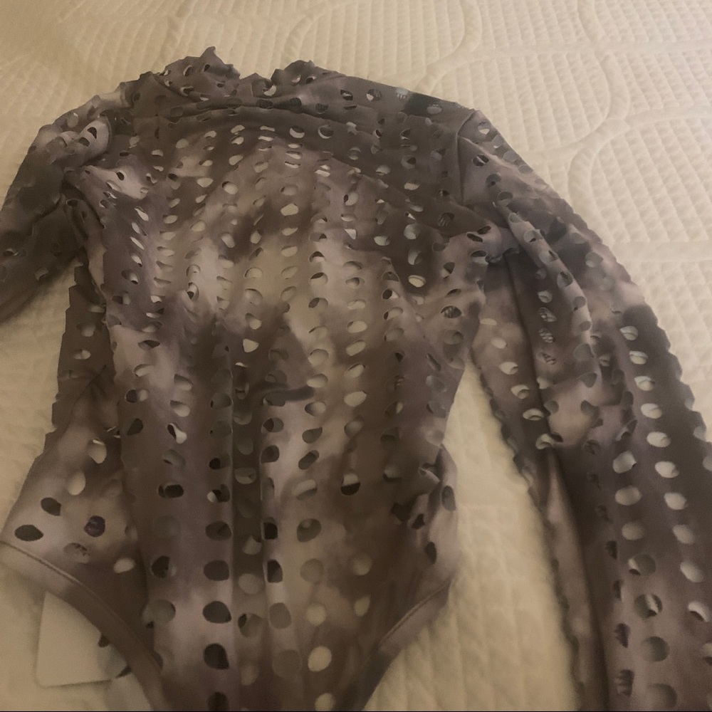 Grayish ombré sexy body suit   top  open areas reveal the skin. Must see